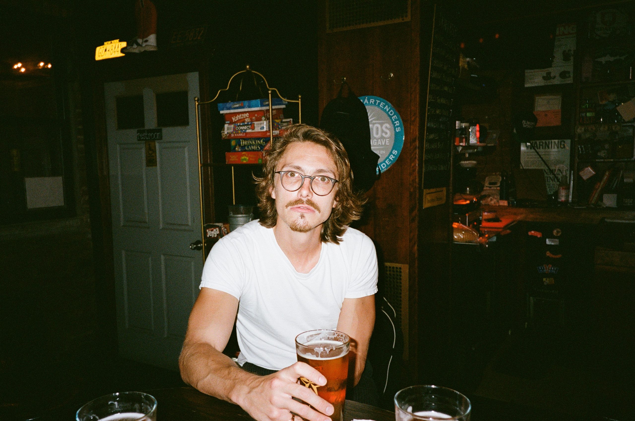 Marc Rebillet holding a pint of beer